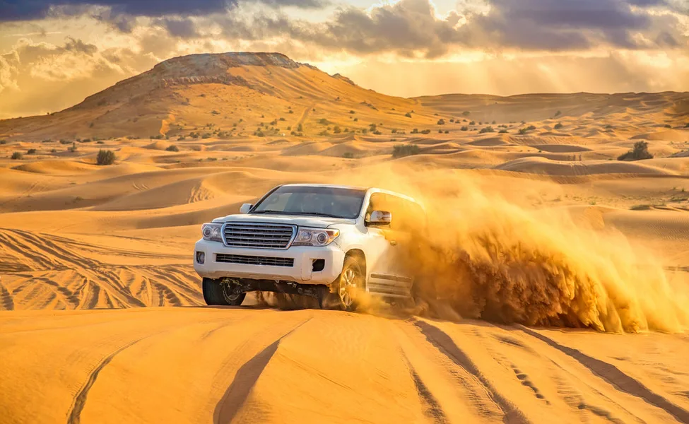 Camel ride across the red dunes